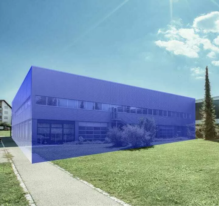 Modern office building with a transparent blue digital overlay highlighting its structure under a sunny sky.